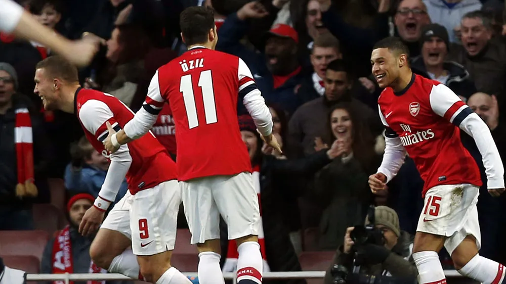 Podolski marcou o segundo gol do Arsenal na partida com o Liverpool (AP Photo/Sang Tan)