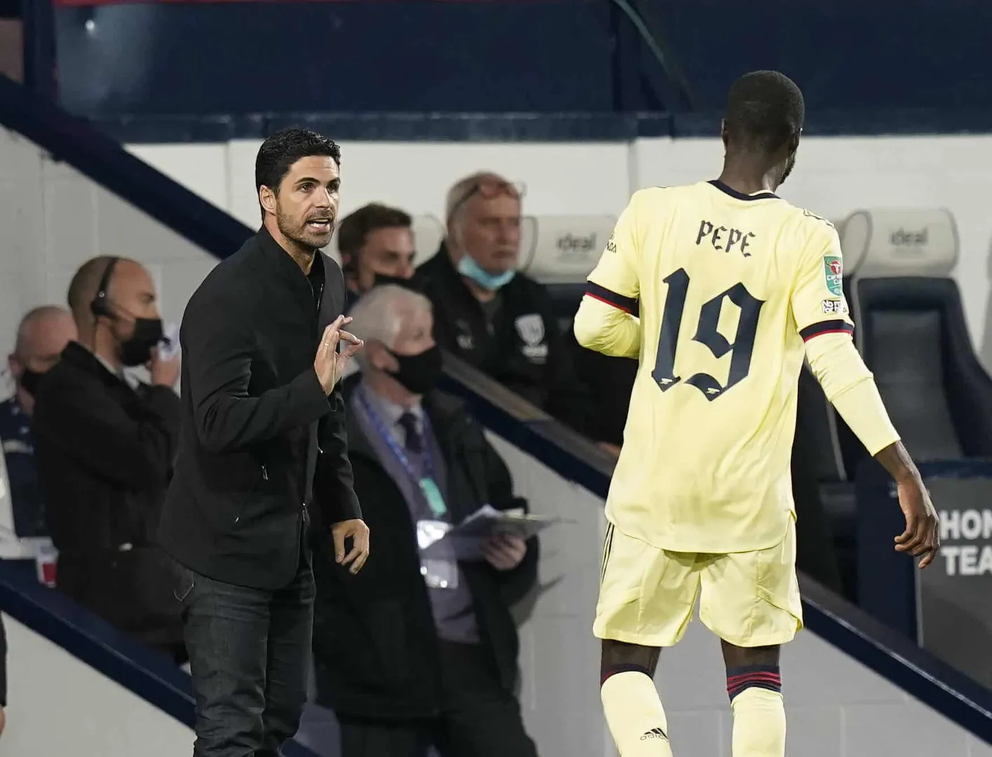 West Bromwich, England, 25th August 2021. Mikel Arteta manager of Arsenal instructs Nicolas Pepe of Arsenal during the C
